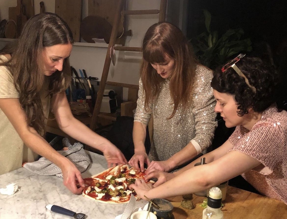 Laura, Hannah and Gaelle making pizza