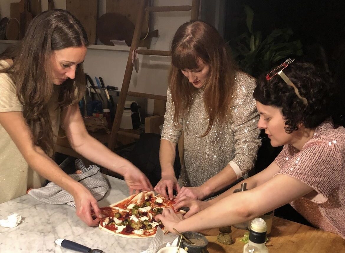 Laura, Hannah and Gaelle making pizza