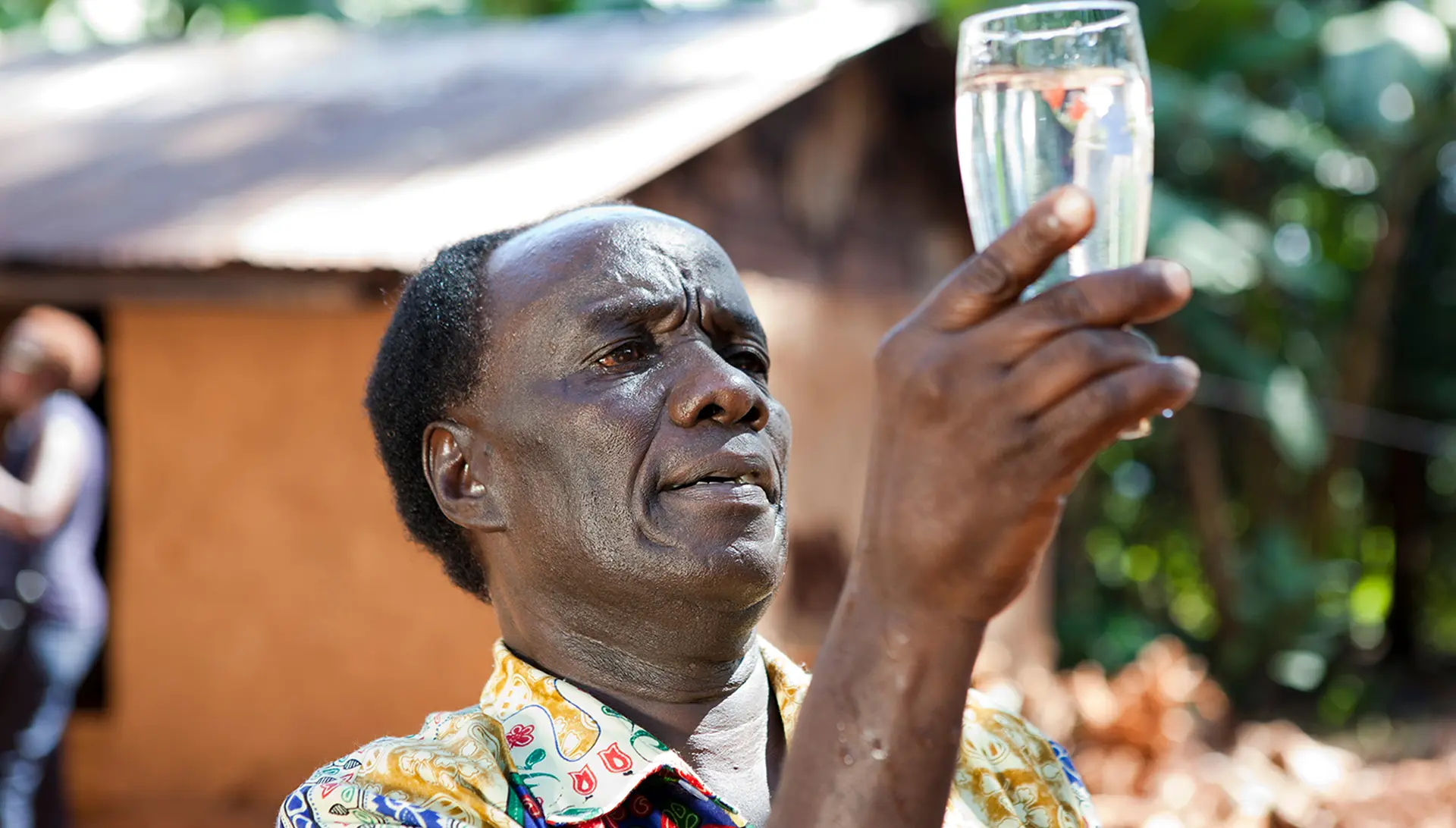 Image of man checking water clarity