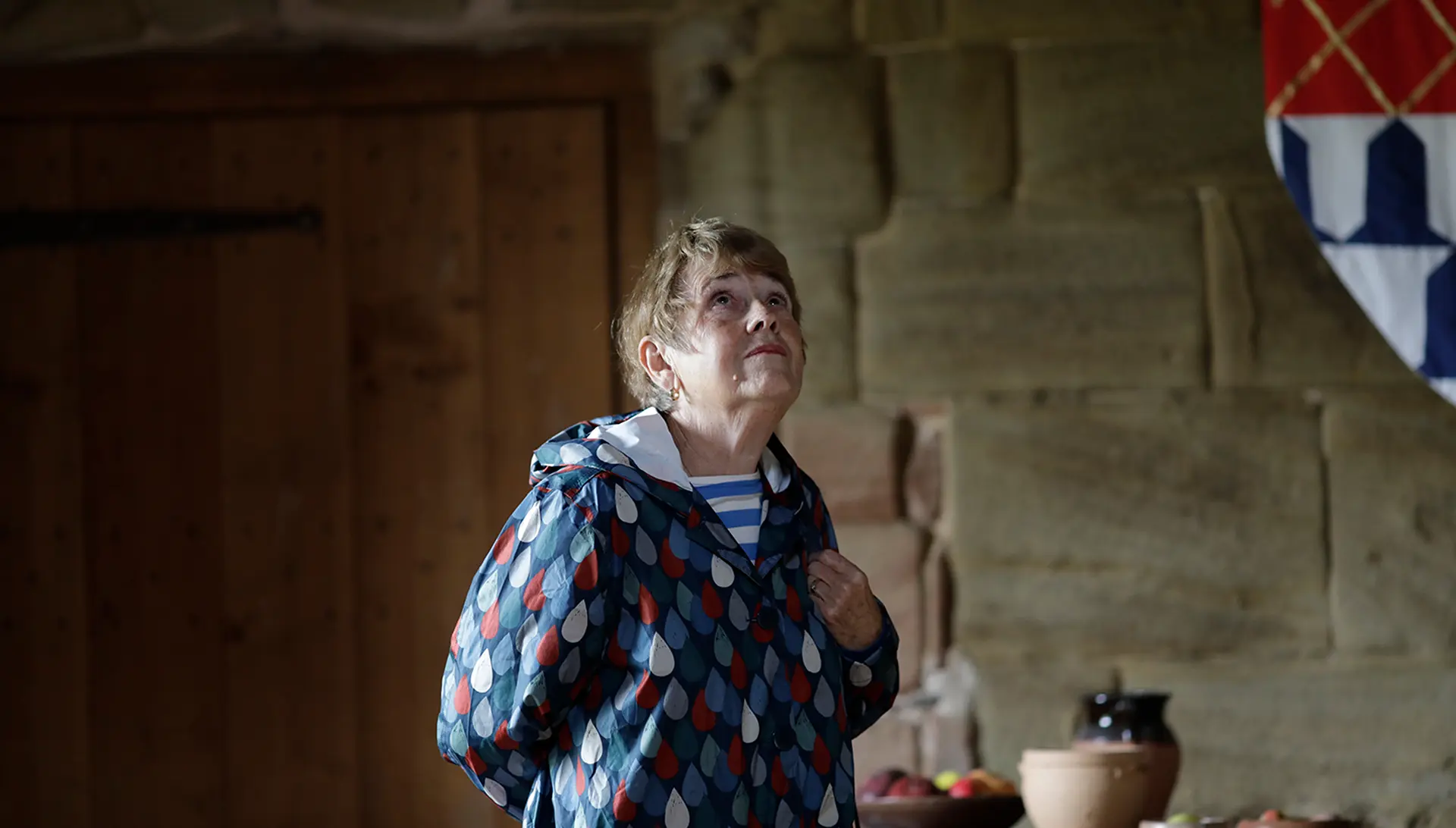 Woman looking at the interior of a historic house