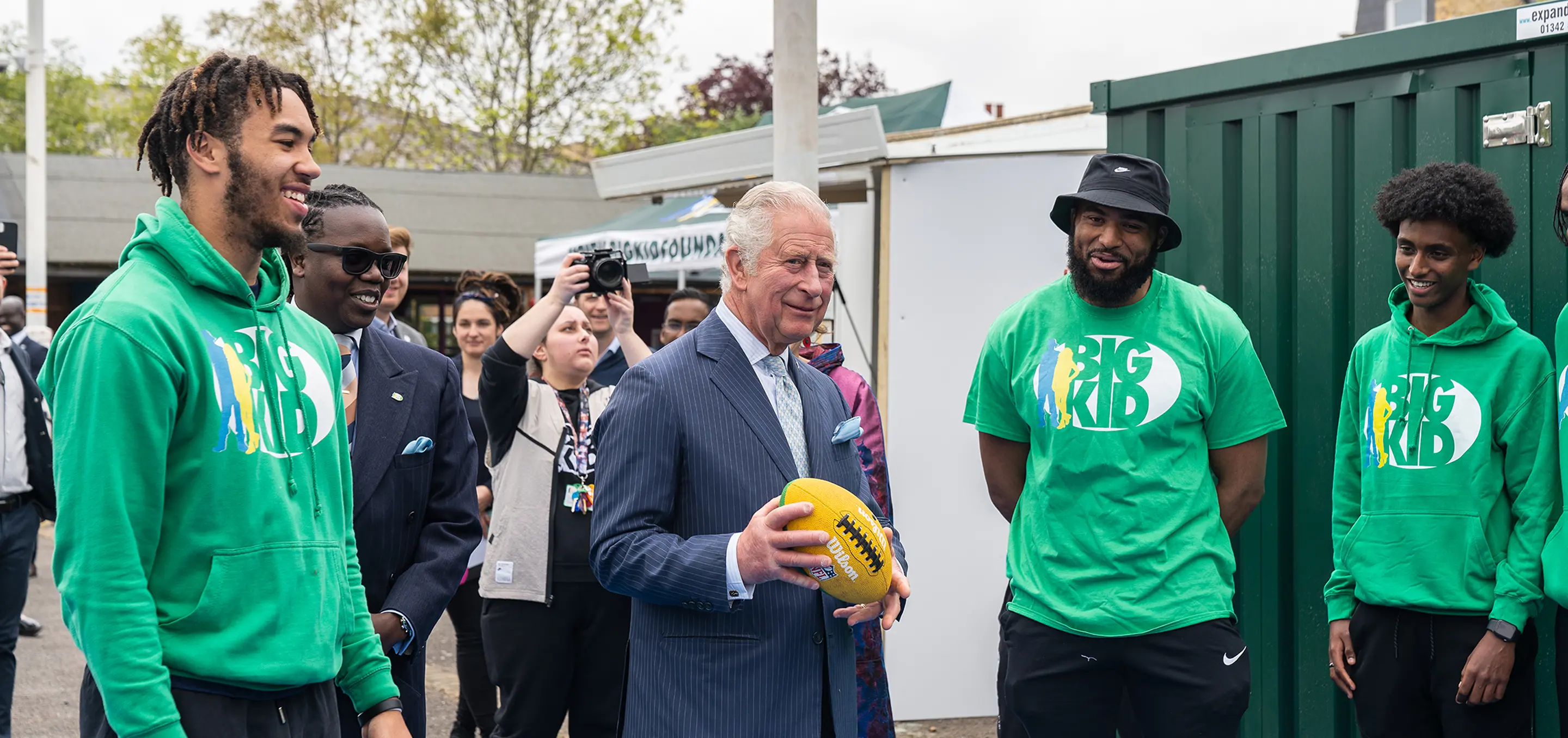 Image of King Charles with a group of men from Big Kid charity